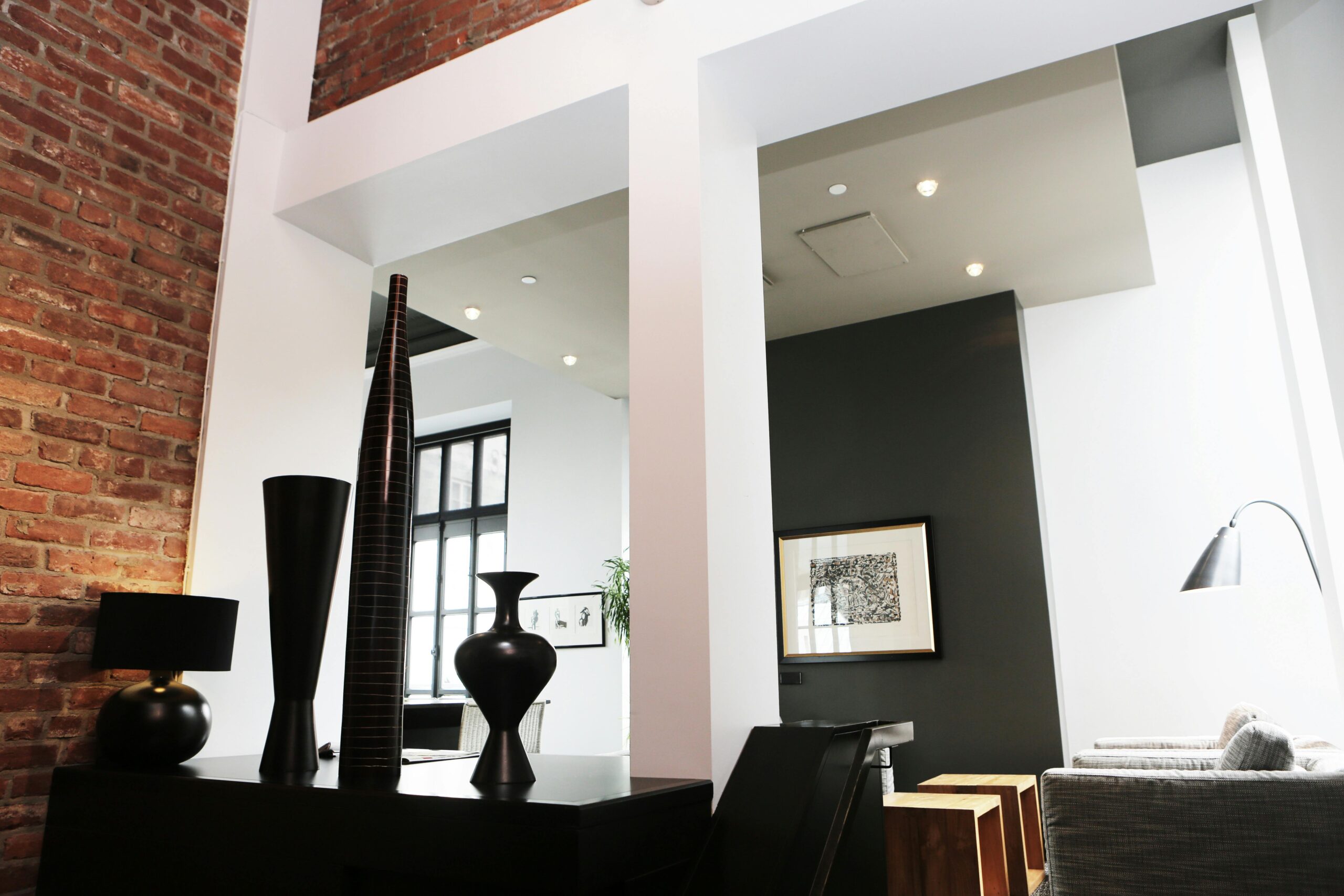 Sleek and modern loft with contemporary interior decor, featuring exposed brick and elegant accents.