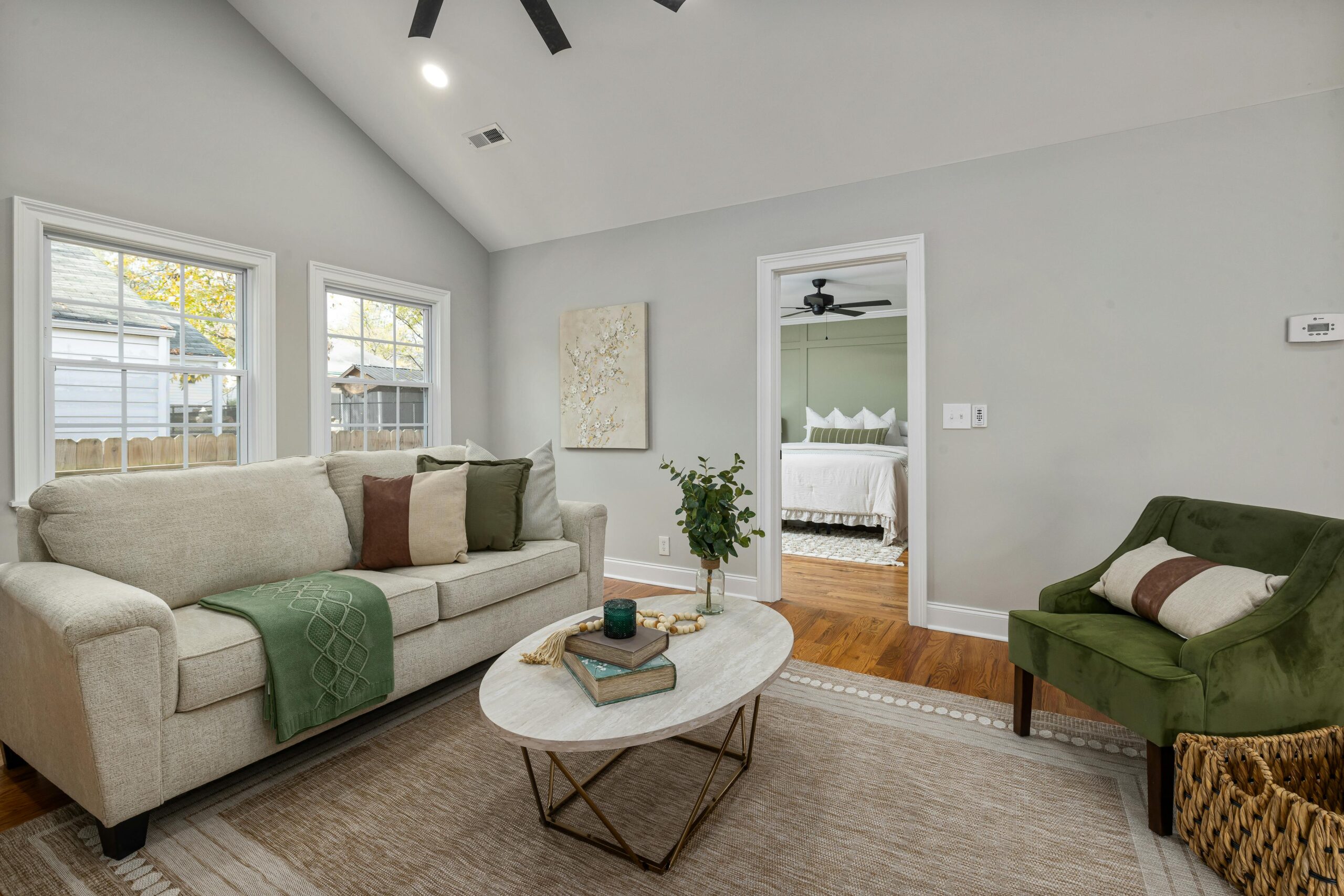 East Nashville cottage A serene modern living room showcasing elegant furniture and decor with a cozy atmosphere.