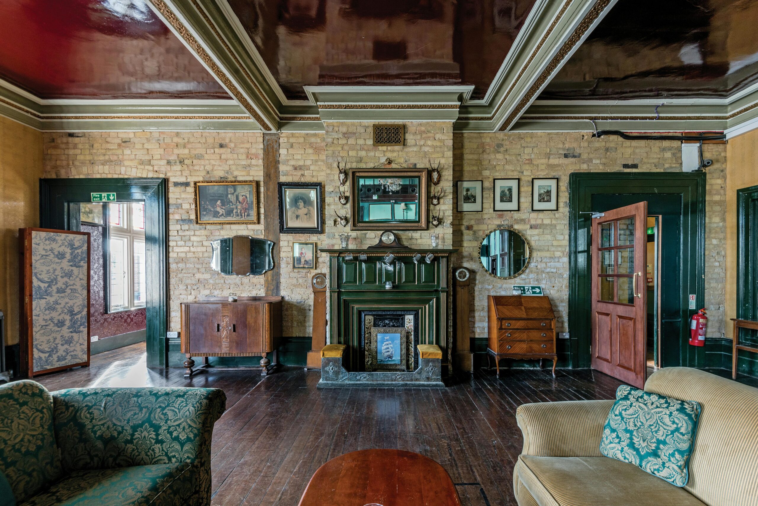 Tudor revival near City Park A charming vintage living room featuring classic decor and wooden flooring, perfect for nostalgic inspiration.